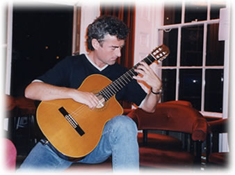 Bernard Sullivan on classical guitar trying to play an impossible chord.