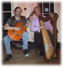 Kevin on Guitar (not whistle thank goodness) and Peter on harp.